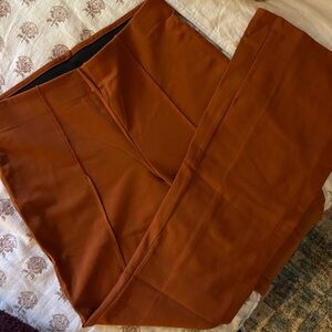 Burnt orange, pleated flare trousers. A New Day, a Target Brand.